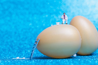 Figurines and eggs on table