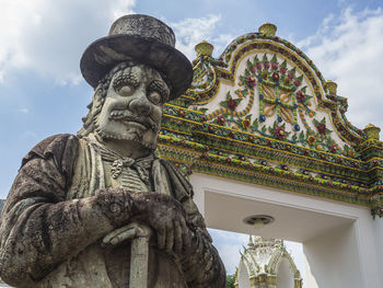 Low angle view of statue against sky