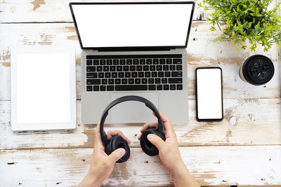 Directly above view of man using laptop on table