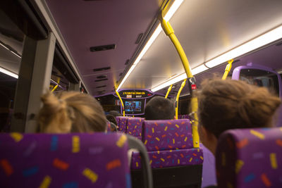 Rear view of people in bus