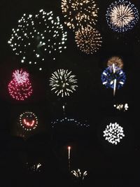 Low angle view of firework display at night