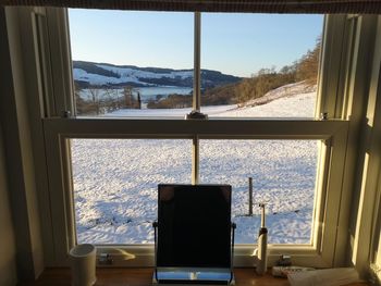 Scenic view of sea seen through window