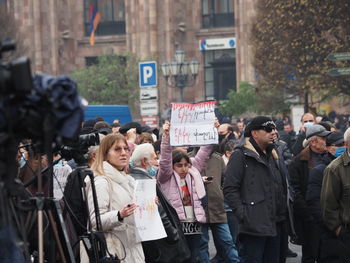 People standing on street in city