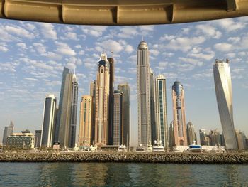 Skyscrapers at dubai marina against sky