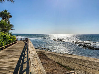 Scenic view of sea against blue sky