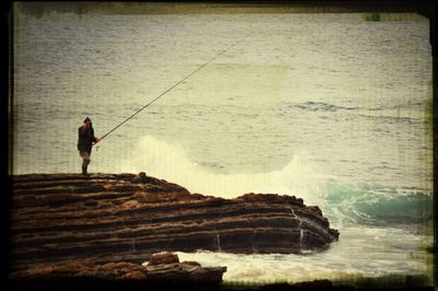 Woman standing on rocks