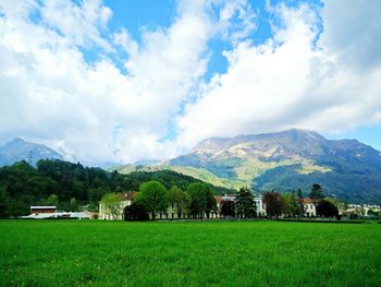Scenic view of landscape against cloudy sky