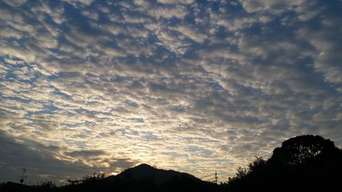 Low angle view of silhouette mountain against sky during sunset