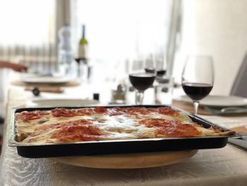 Close-up of pizza on table in restaurant