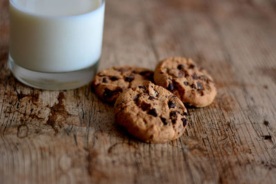 Close-up of cookies with milk on table