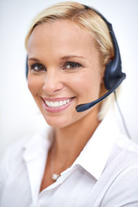 Portrait of young woman with headset