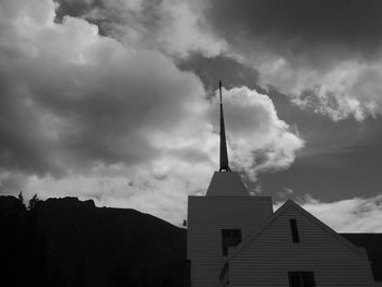 Low angle view of building against cloudy sky