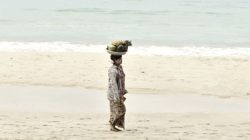 Woman standing on beach