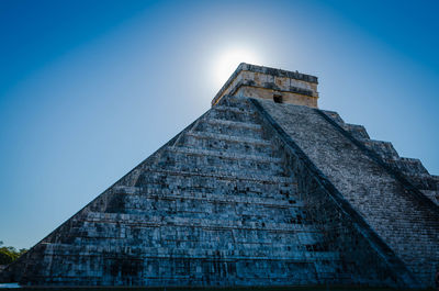 Low angle view of historical building against blue sky