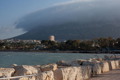 Scenic view of sea against cloudy sky