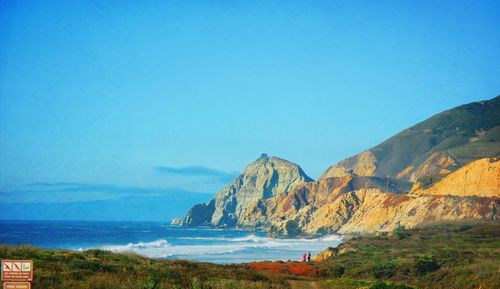 Scenic view of sea against blue sky