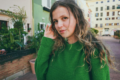 Portrait of woman standing outdoors