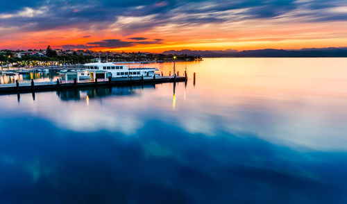 Scenic view of lake against sky during sunset