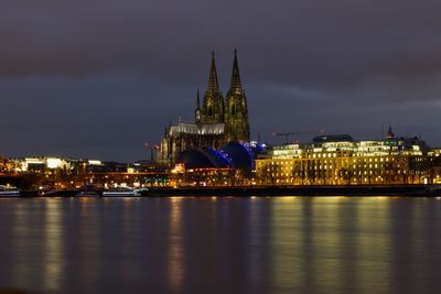 Illuminated city at waterfront