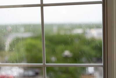 Wet glass window in rainy season