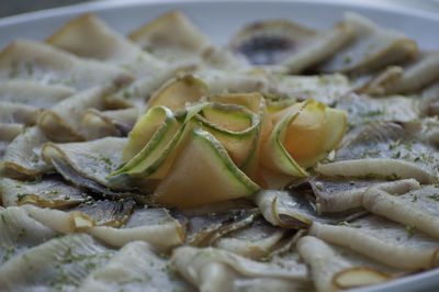 Close-up of garnished tuna served in plate