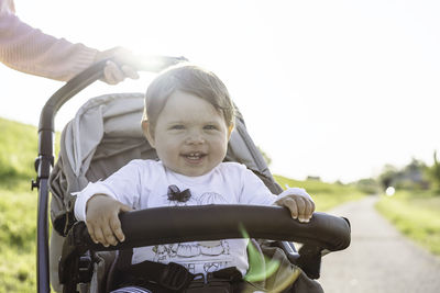 Portrait of cute boy riding motorcycle