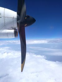 Airplane wing against sky