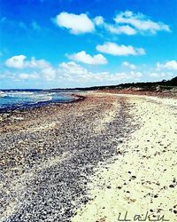 Scenic view of sea against cloudy sky