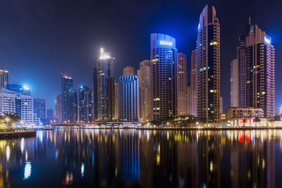 Illuminated buildings in city at night