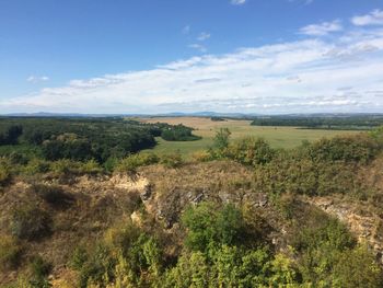 Scenic view of landscape against cloudy sky