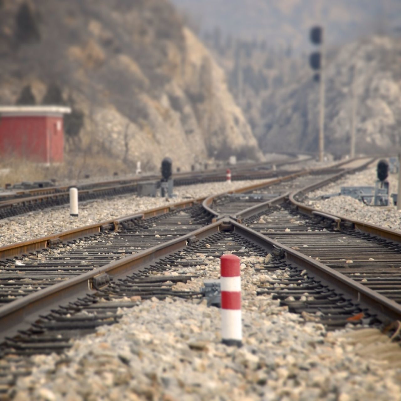 railroad track, rail transportation, transportation, public transportation, railroad station platform, train - vehicle, railroad station, sky, travel, railway track, day, metal, selective focus, diminishing perspective, outdoors, focus on foreground, no people, the way forward, red, train