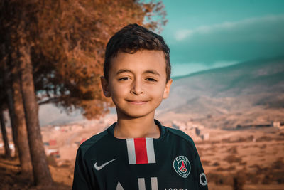 Portrait of boy standing outdoors