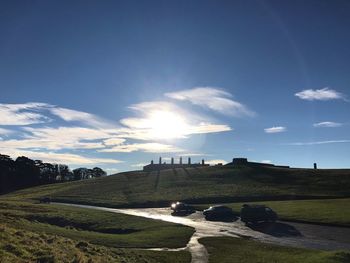 Scenic view of landscape against blue sky