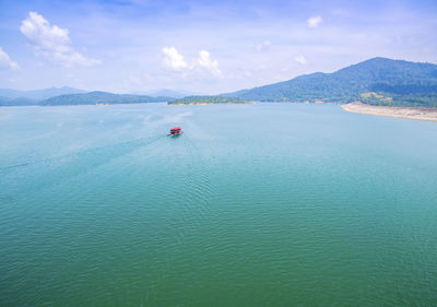 High angle view of boat in calm blue sea