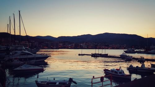 Boats moored at harbor