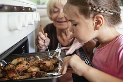 Mother and girl having food