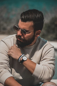 Portrait of young man wearing sunglasses