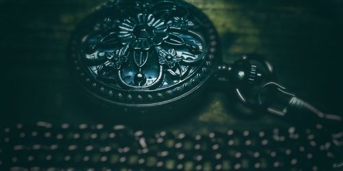 High angle view of clock on table