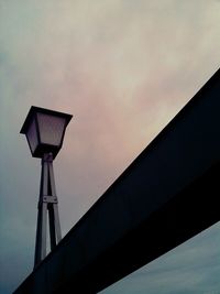 High section of built structure against sunset sky