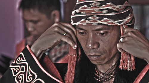 Close-up portrait of man wearing mask