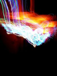 Close-up of light trails against black background