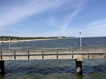 Pier over sea against sky