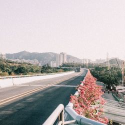 View of city street against clear sky