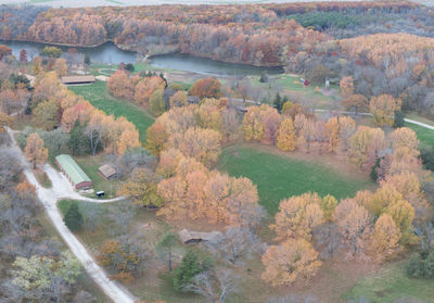 High angle view of trees by river against sky