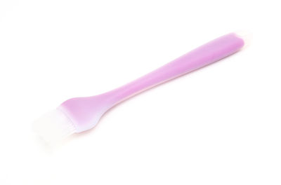 High angle view of pink pencils against white background