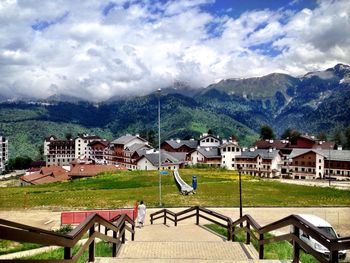 Houses on mountain against sky