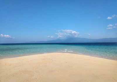 Scenic view of sea against blue sky