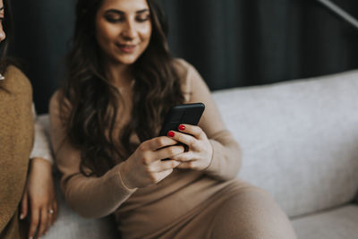 Woman holding cell phone