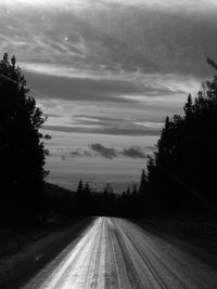 View of road against cloudy sky