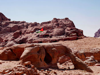 Rock formations on mountain against clear sky